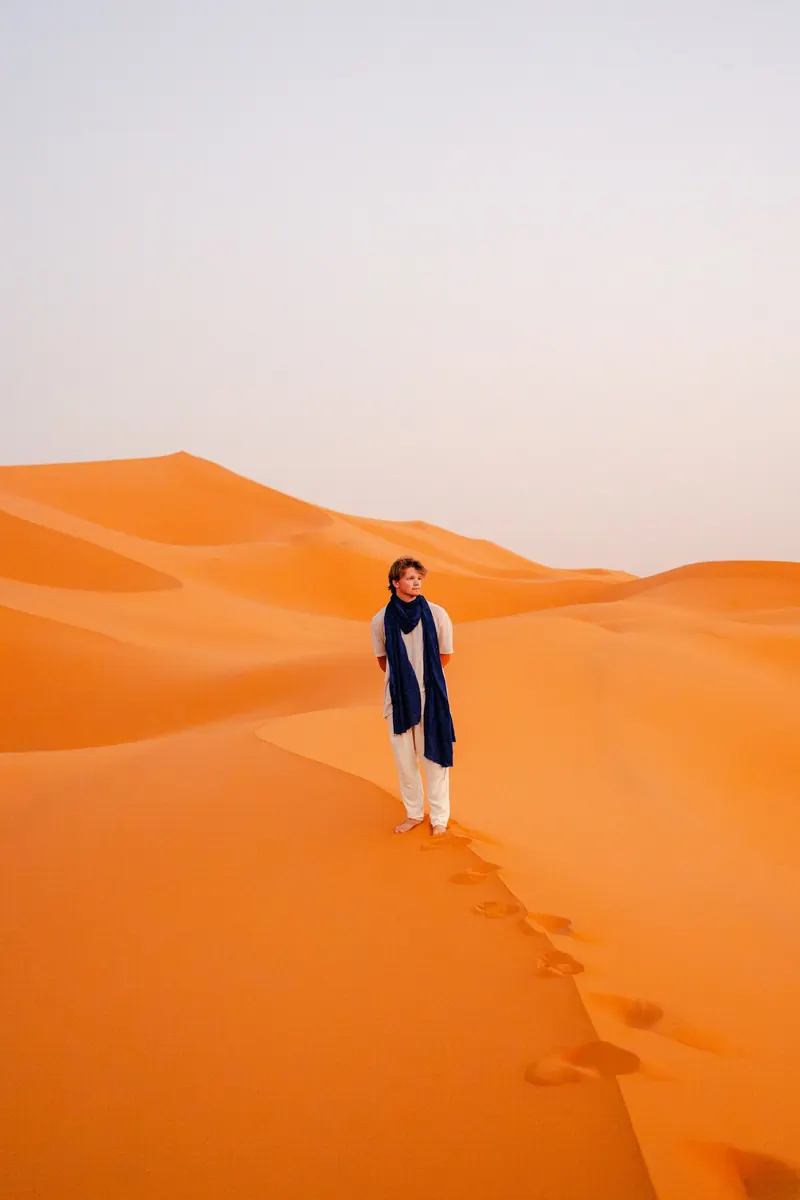 Responsible off-road riding in the Sahara Single traveller following a low-impact route across desert sand