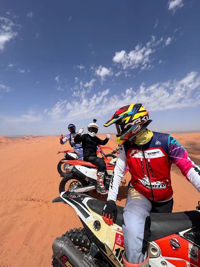 KTM enduro riders gathered during a Merzouga desert stage Rider on the Merzouga — Tafraout — M'Harech enduro route