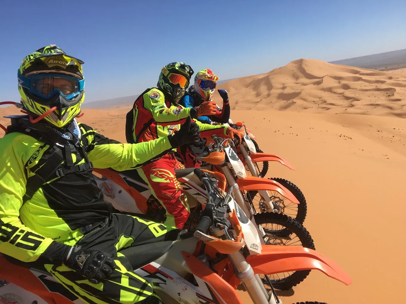 Merzouga enduro riders posing during a guided Sahara tour Rider on the Merzouga — Tafraout — Merzouga enduro route